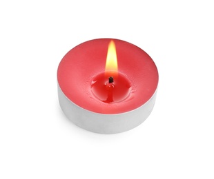 Colorful wax candle burning on white background