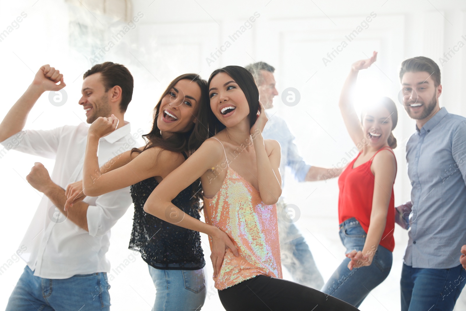 Photo of Couple of happy friends dancing at party