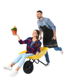 Photo of Couple of gardeners with wheelbarrow on white background