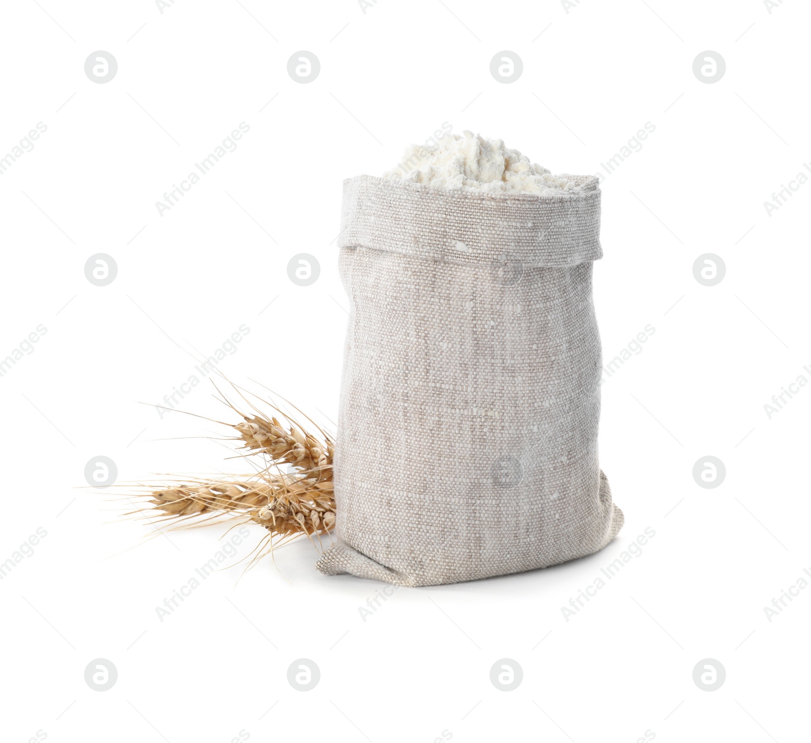 Photo of Sack with flour and wheat spikes on white background