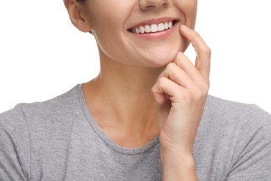 Photo of Woman showing her clean teeth and smiling on white background, closeup