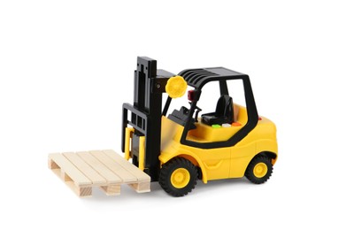 Photo of Toy forklift with wooden pallet on white background