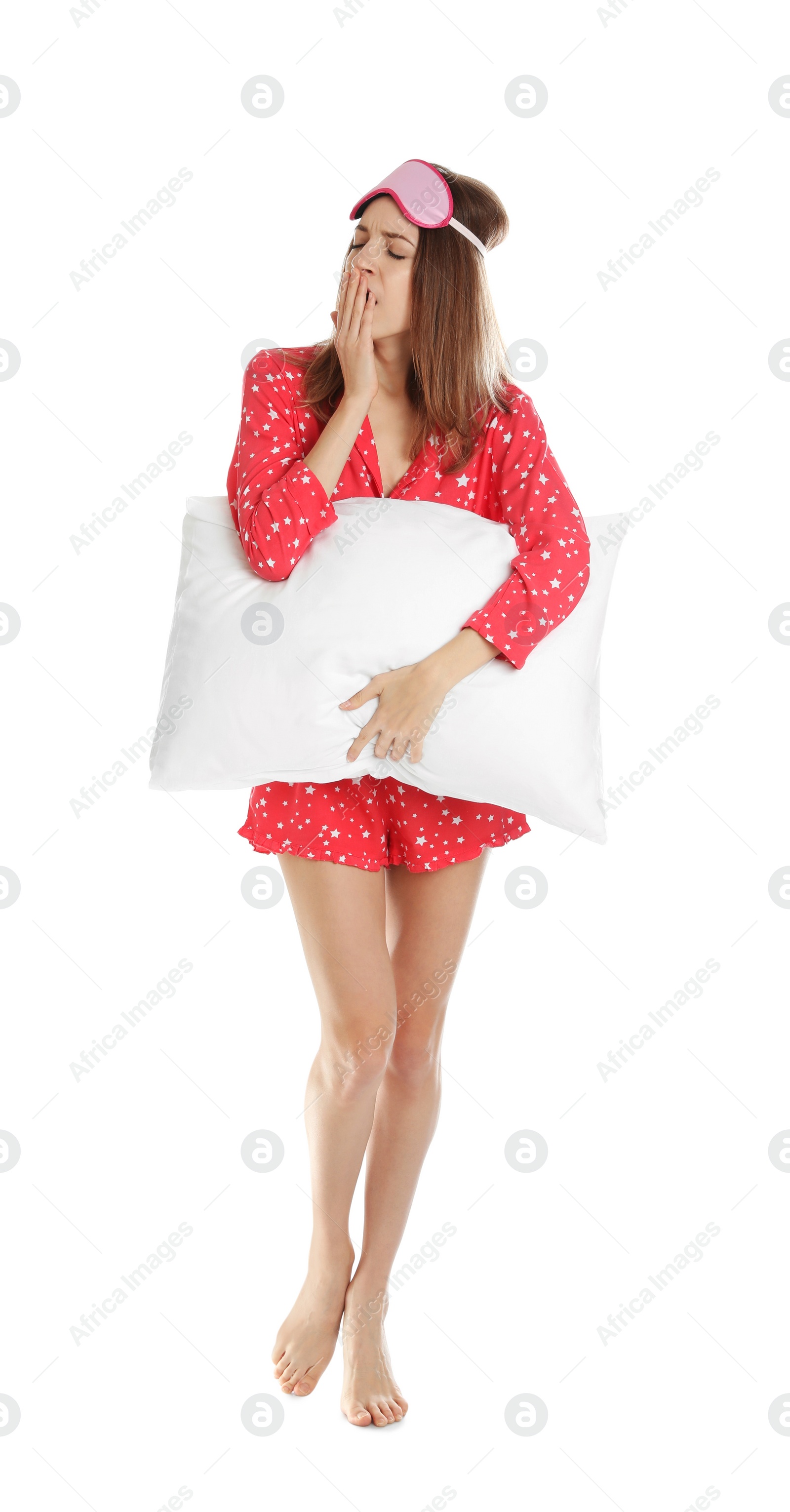 Photo of Beautiful woman with pillow and sleep mask on white background. Bedtime