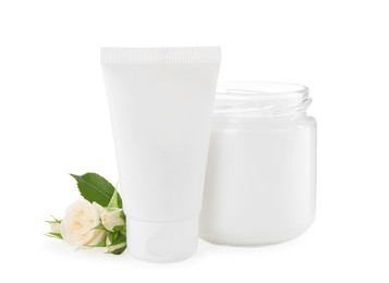 Photo of Different hand care cosmetic products and roses on white background