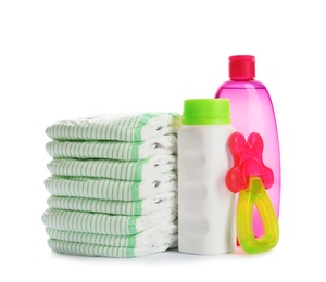 Photo of Stack of diapers and baby accessories on white background