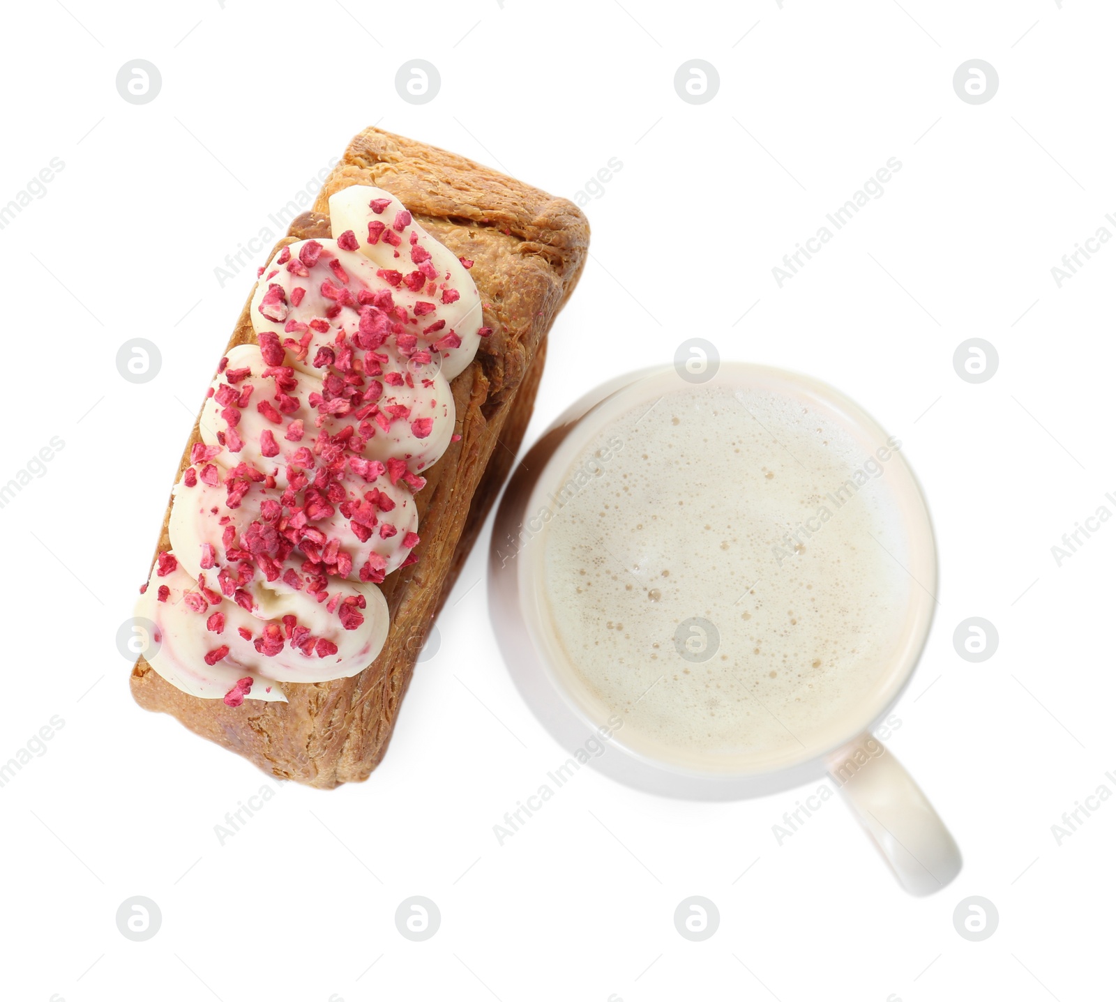Photo of Round croissant with cream and cup of drink isolated on white, top view. Tasty puff pastry