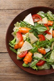 Photo of Delicious turnip salad served on wooden table, top view