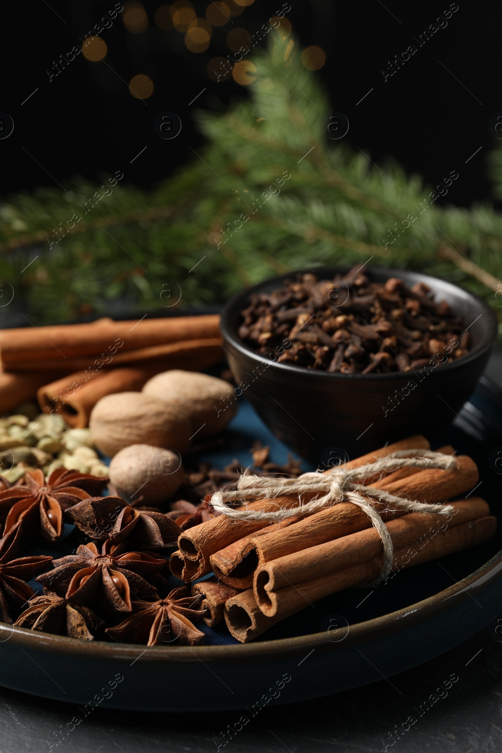 Photo of Dishware with different spices and on table, closeup