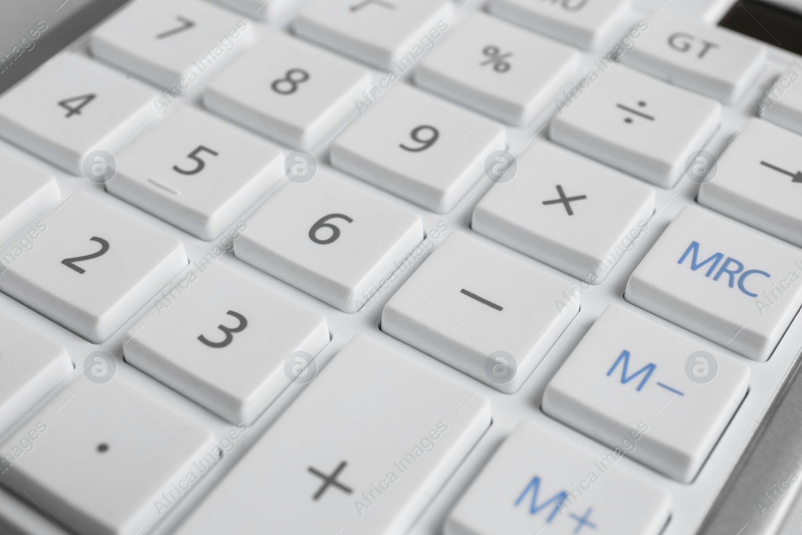 Photo of Closeup view of white calculator as background