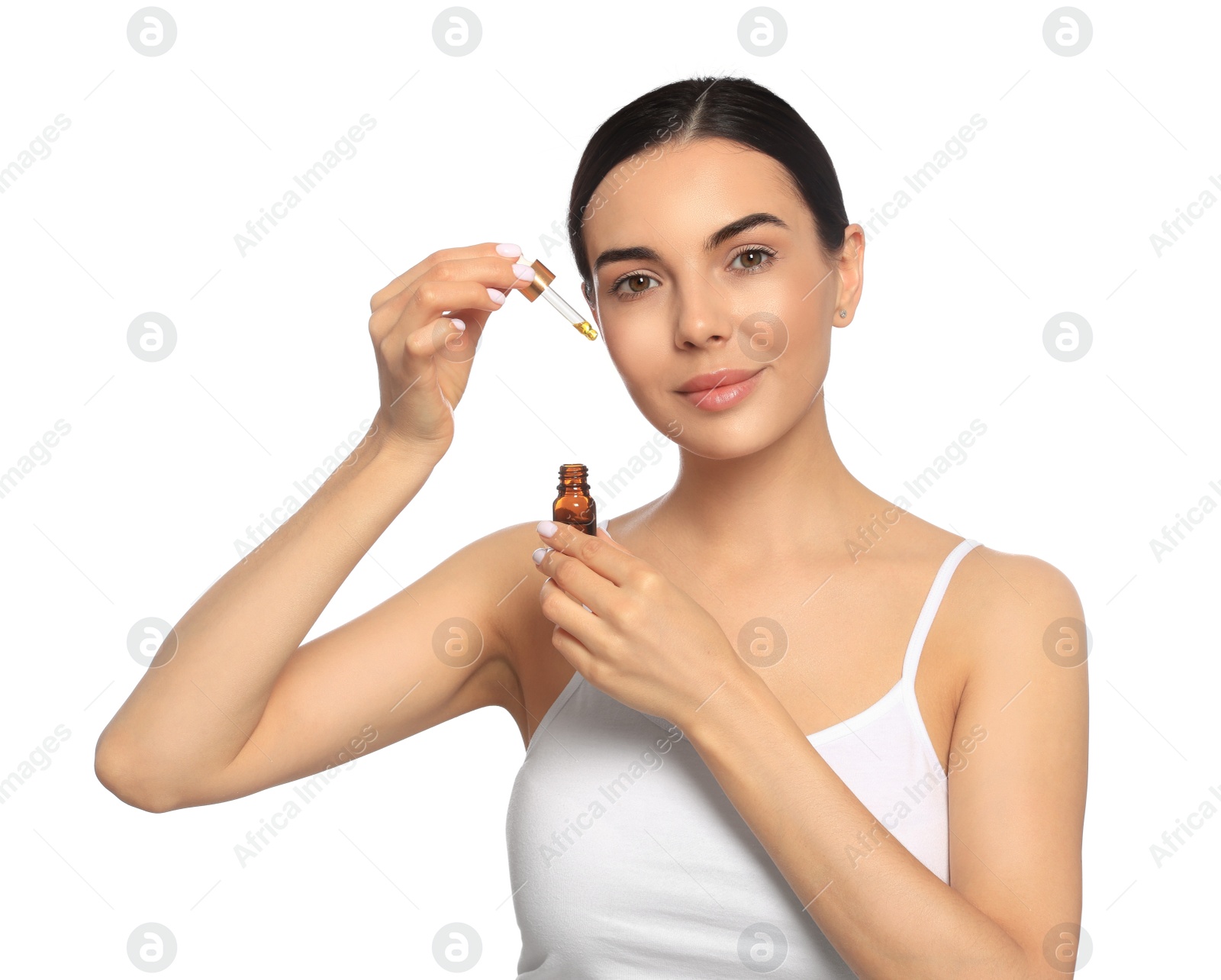 Photo of Young woman with bottle of essential oil on white background