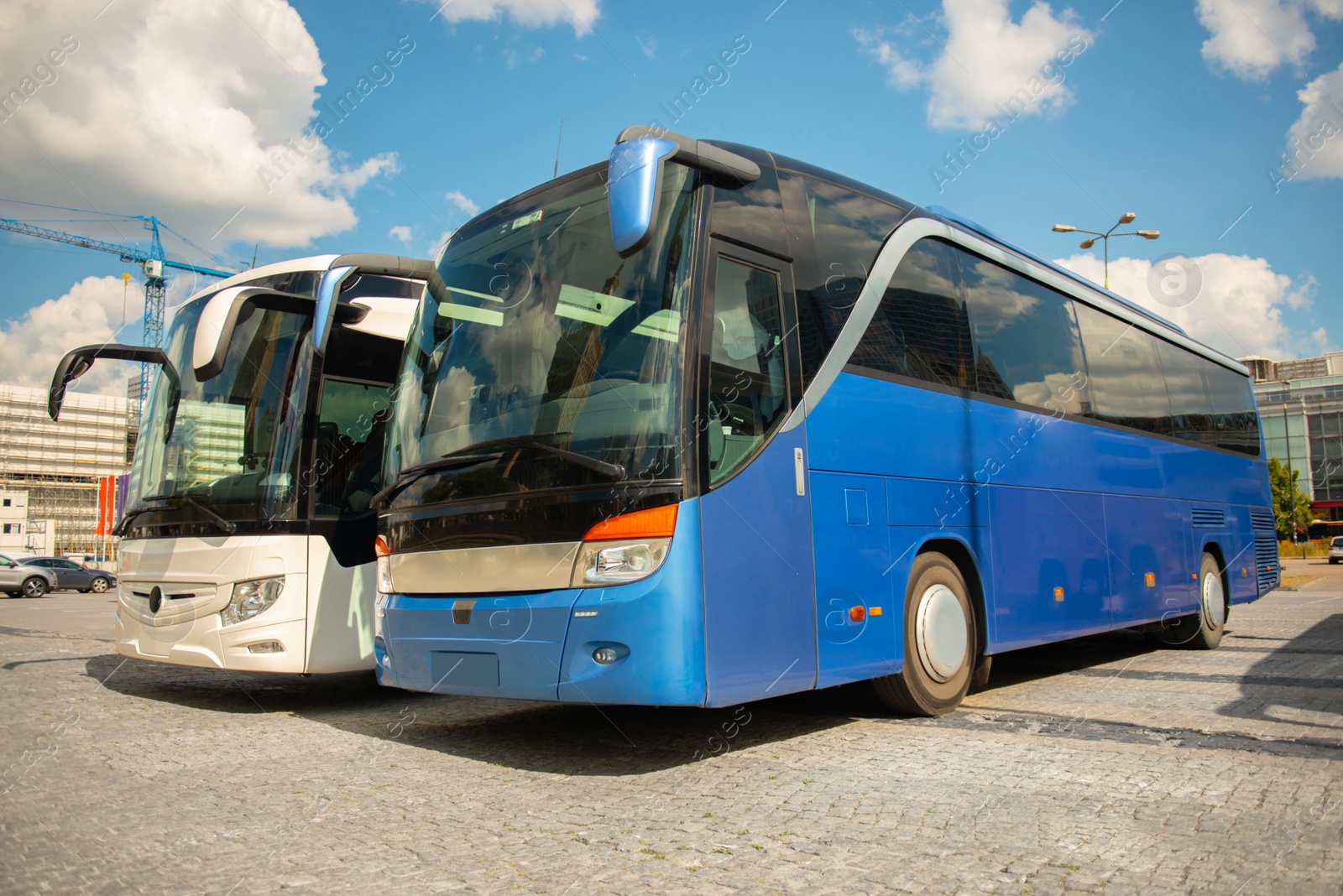 Photo of Public transport station with modern buses on sunny day