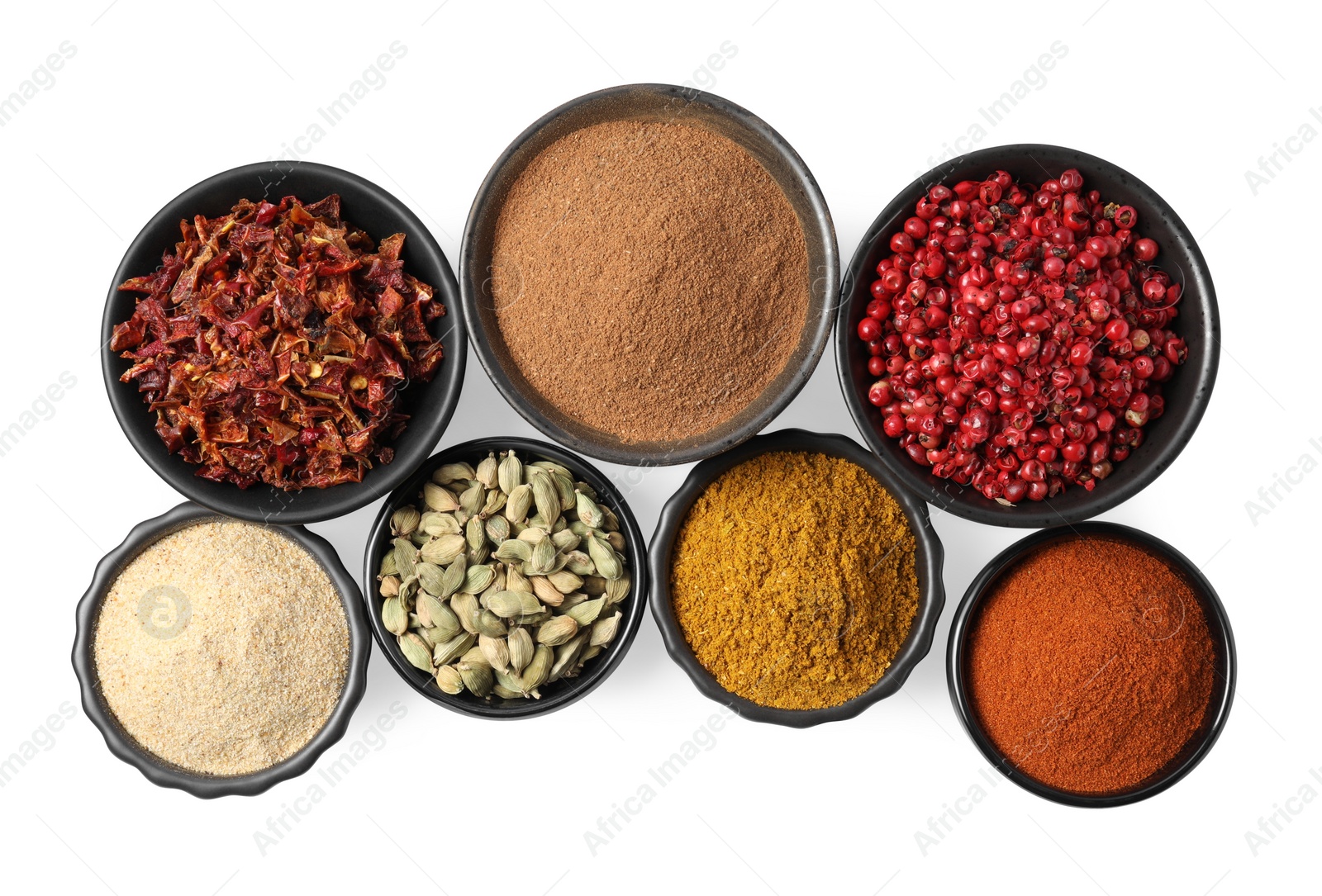 Photo of Bowls with different spices on white background, top view