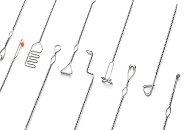 Photo of Set of logopedic probes on white background. Speech therapist's tools
