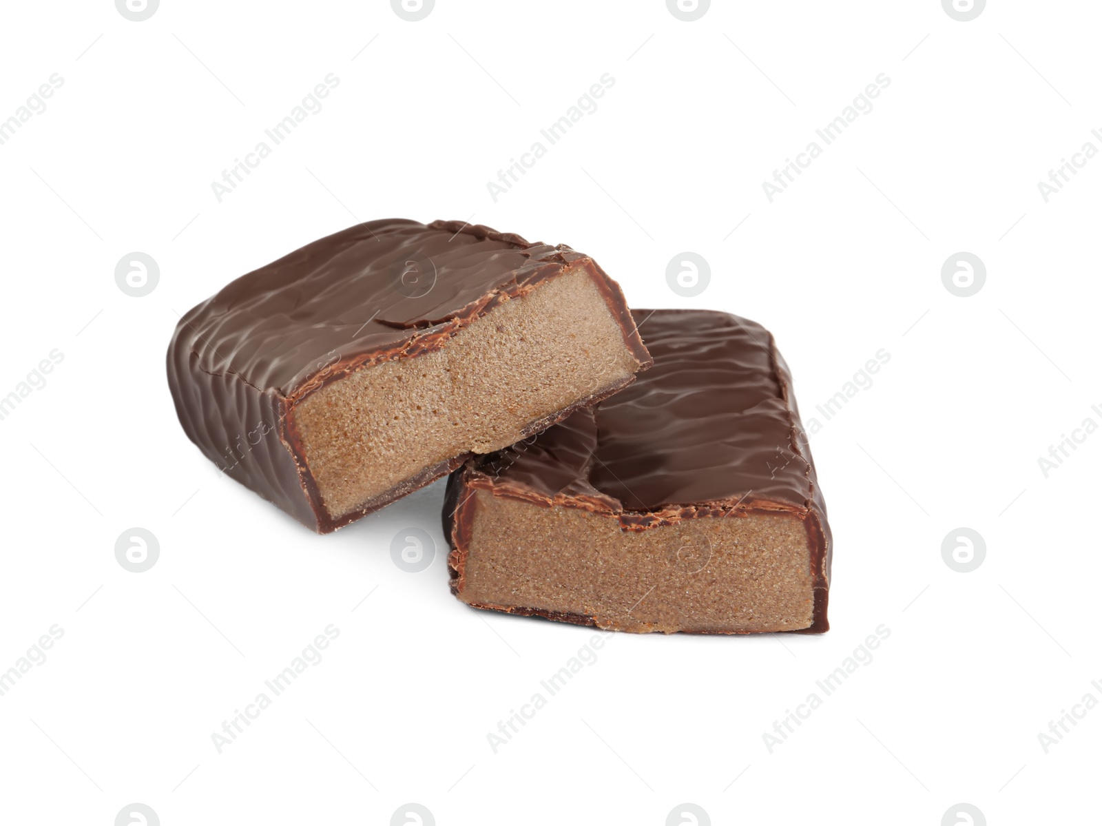 Photo of Halves of tasty chocolate glazed protein bar on white background