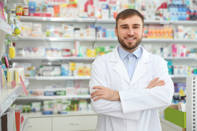 Image of Portrait of professional pharmacist in modern drugstore. Space for text