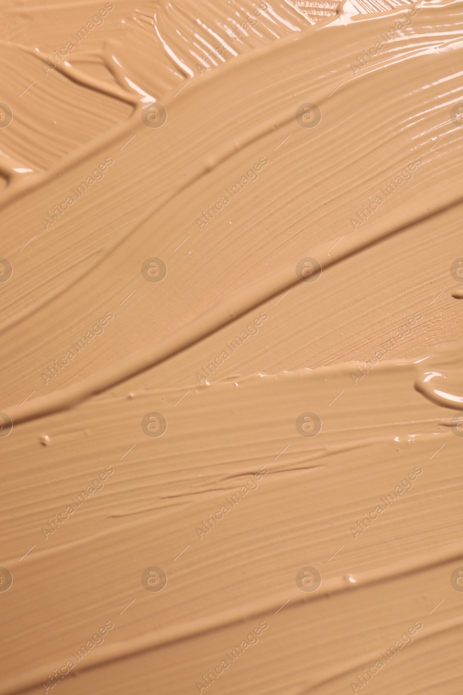 Photo of Texture of skin foundation as background, closeup