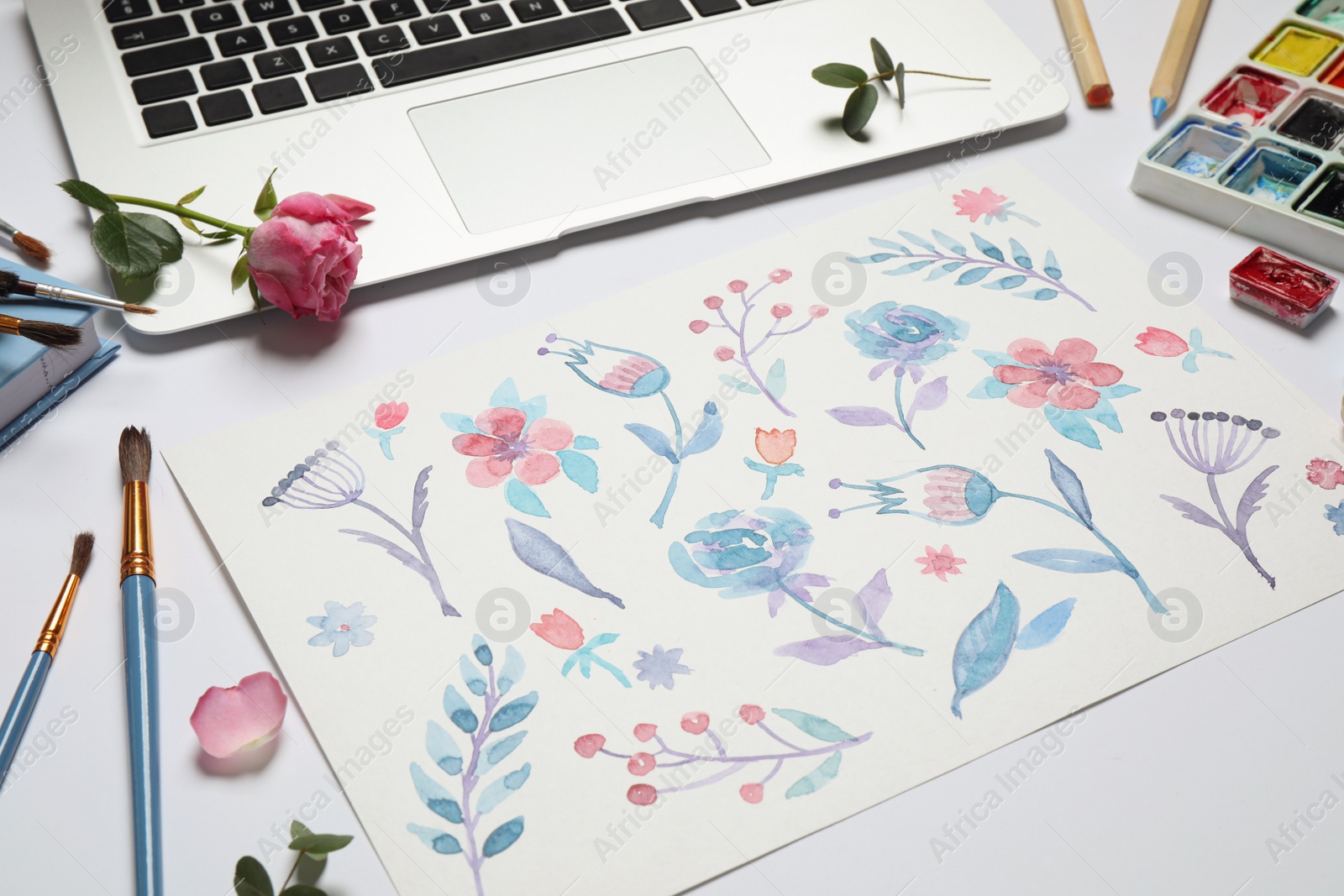 Photo of Composition with floral picture and watercolor paints on white background