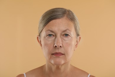 Woman with normal skin on beige background