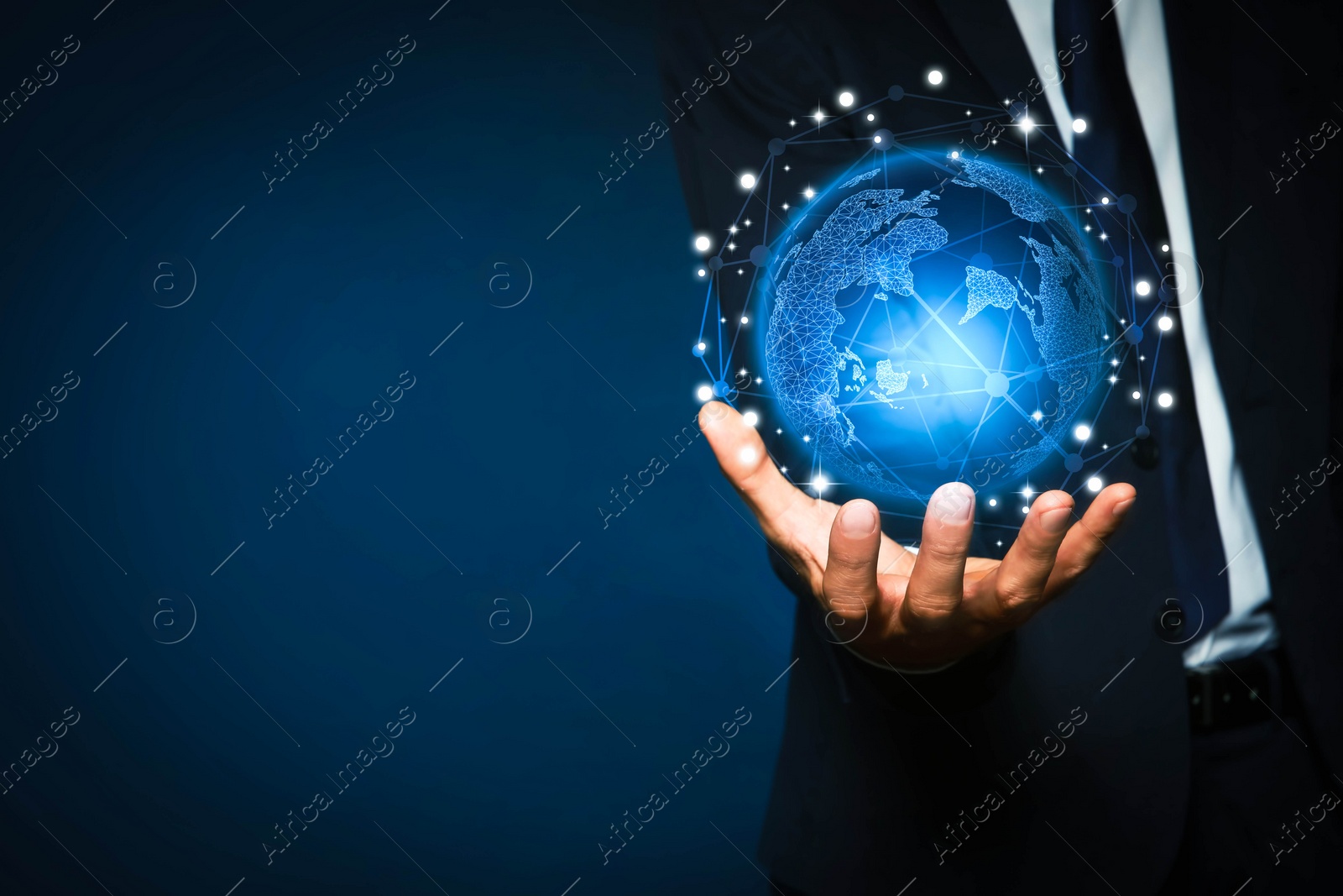 Image of Global innovation. Businessman holding virtual planet on dark blue background, closeup. Space for text