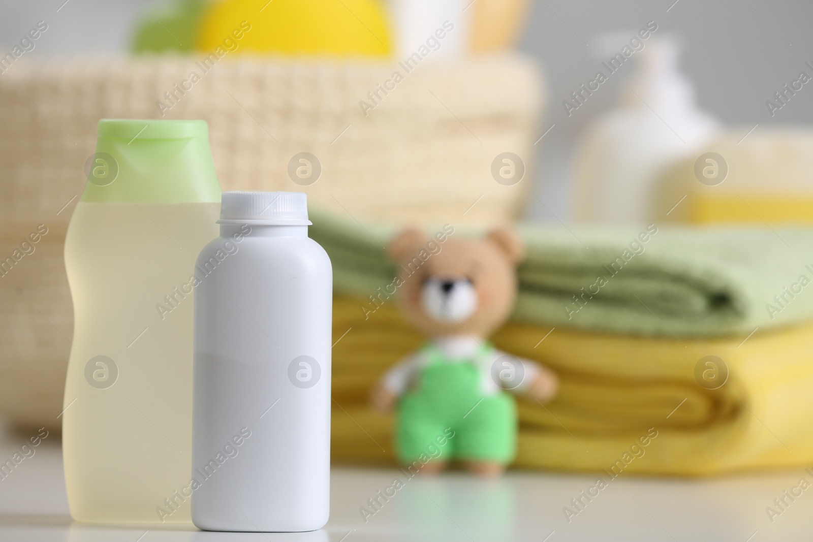 Photo of Baby cosmetic products on white table, space for text