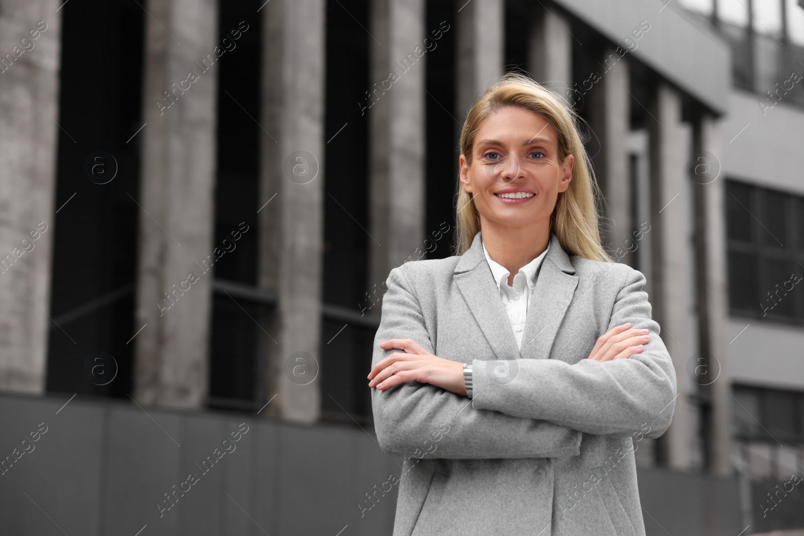 Photo of Portrait of happy woman outdoors, space for text. Lawyer, businesswoman, accountant or manager