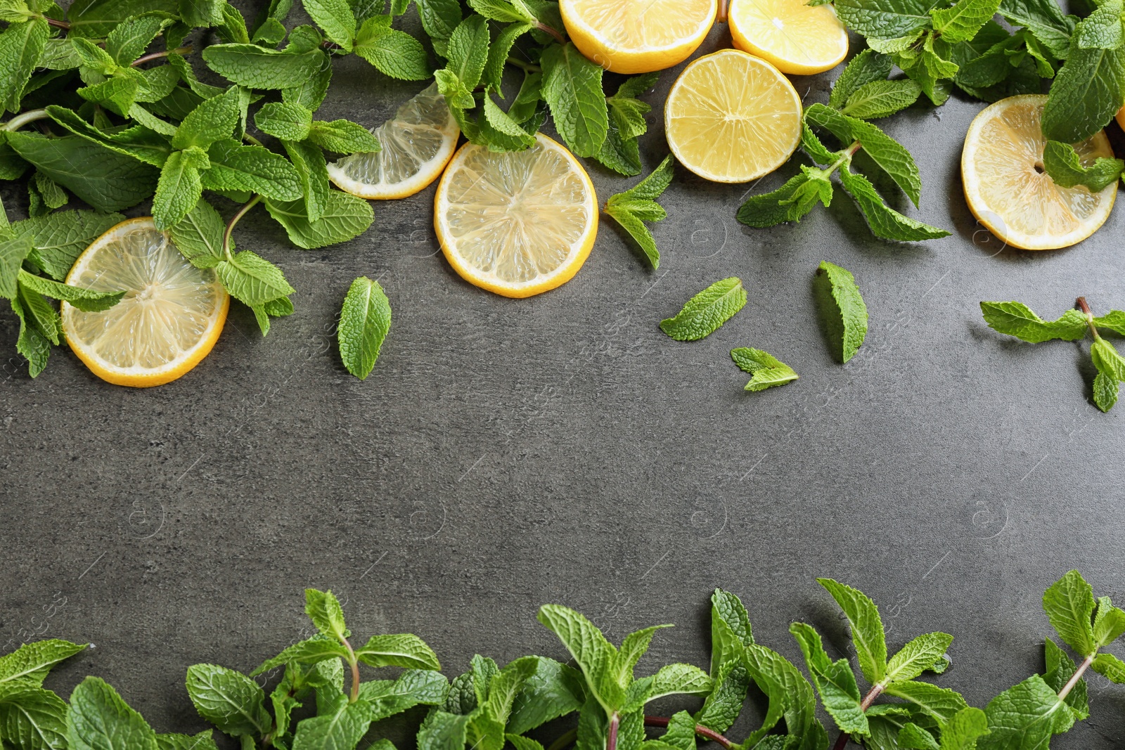 Photo of Flat lay composition with mint and citrus fruit on grey background