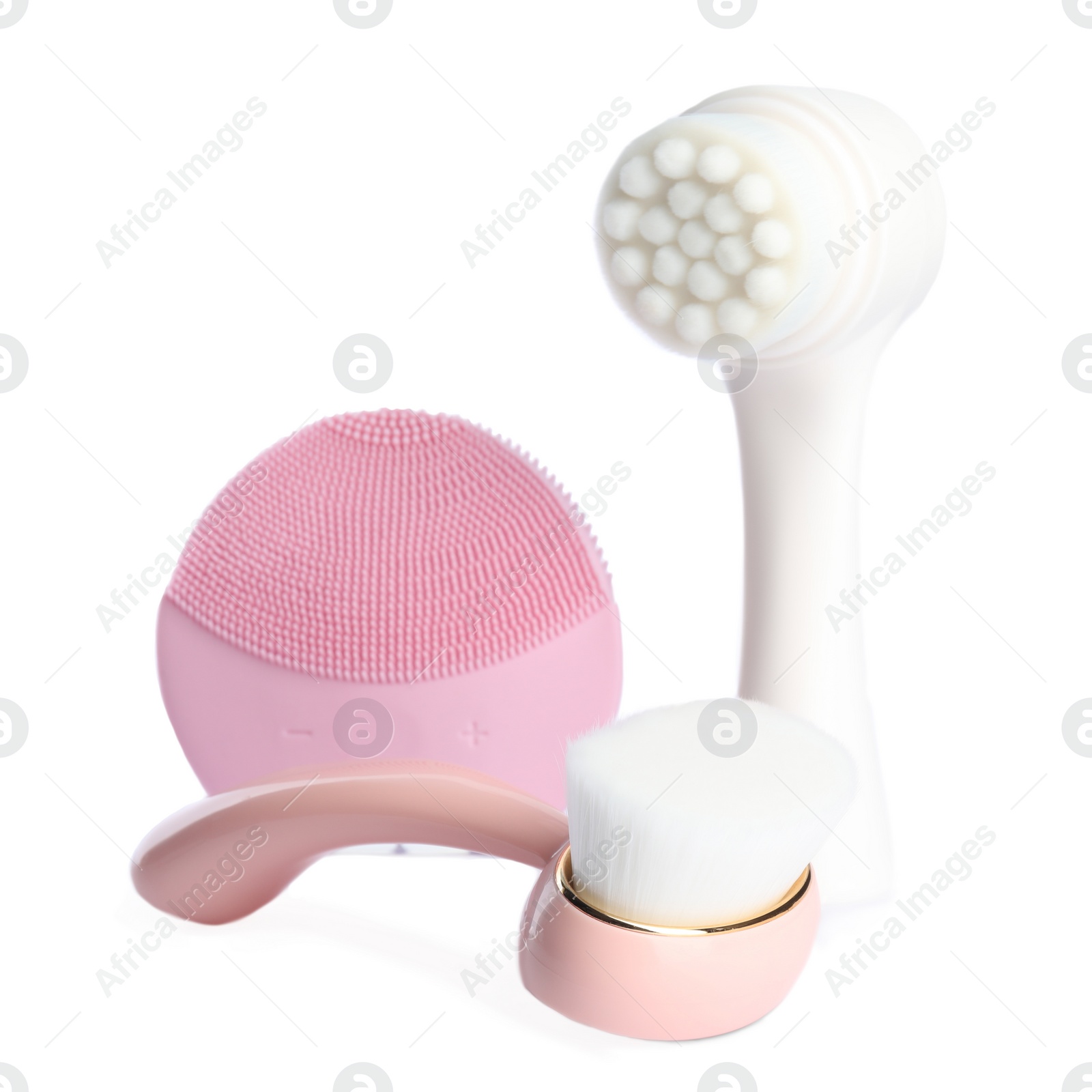 Photo of Face cleansing brushes isolated on white. Cosmetic tools