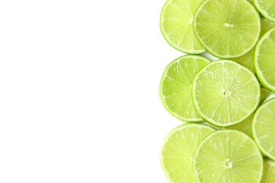 Photo of Fresh juicy lime slices on white background, flat lay. Space for text