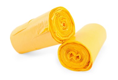 Photo of Two rolls of yellow garbage bags isolated on white