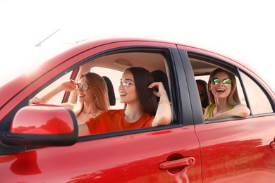 Happy beautiful young women together in car