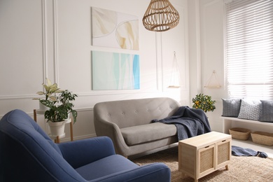 Photo of Beautiful living room interior with comfortable gray sofa