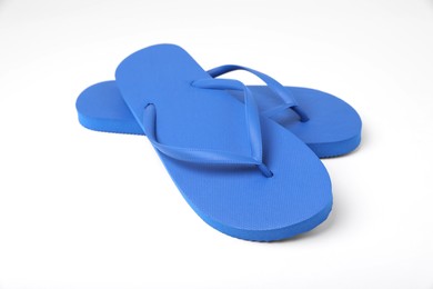 Photo of Stylish blue flip flops on white background