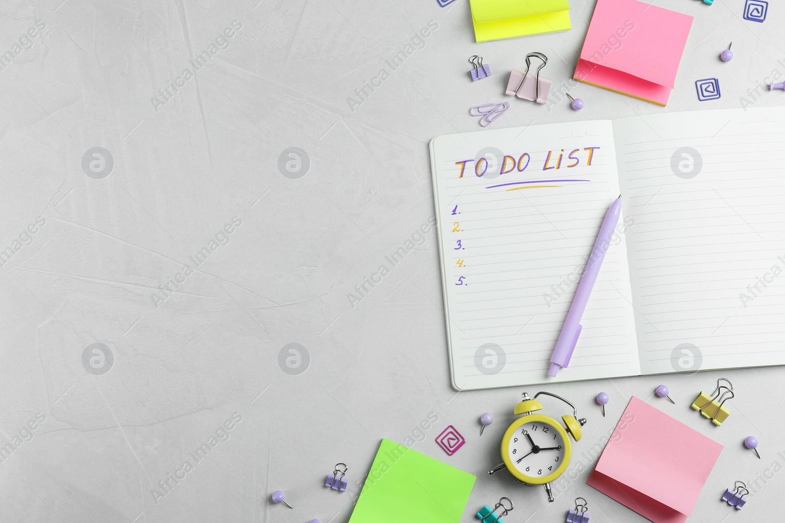 Photo of Flat lay composition of notebook with To Do List and stationery on light grey table, space for text. Planning