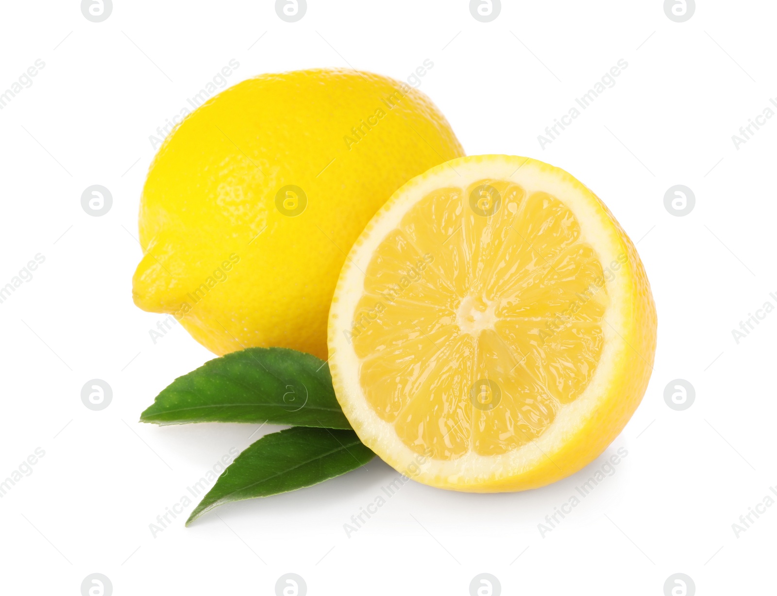 Photo of Cut and whole ripe lemons with green leaves isolated on white