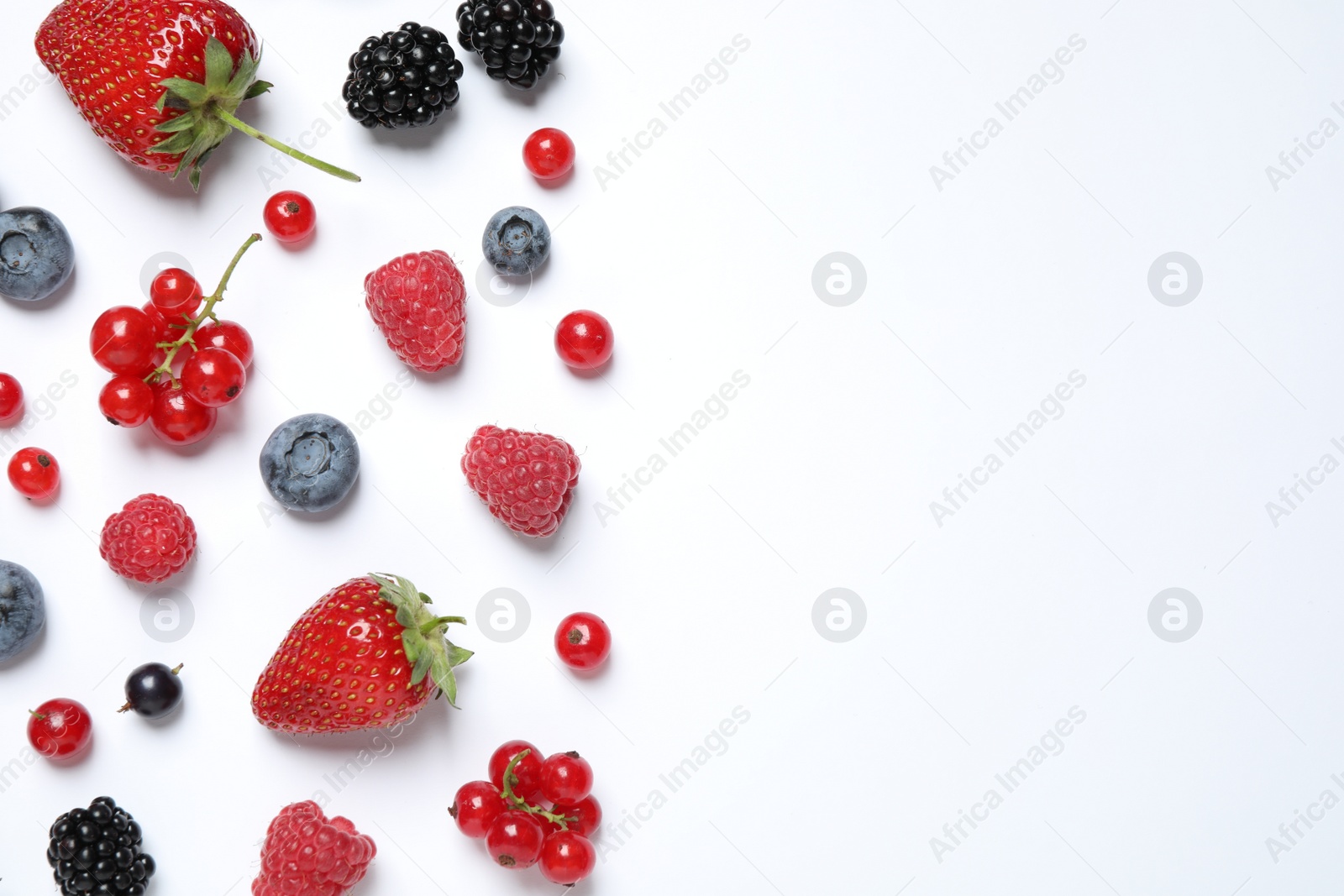 Photo of Mix of fresh berries on white background, flat lay