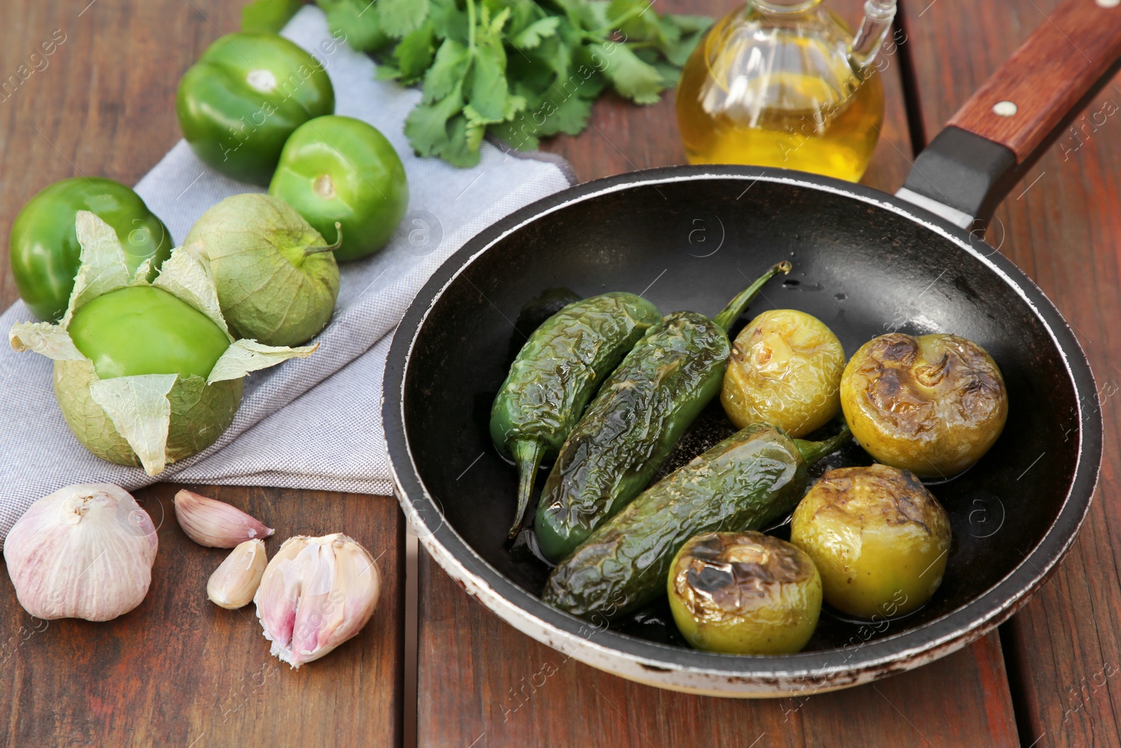 Photo of Different ingredients for cooking tasty salsa sauce on wooden table