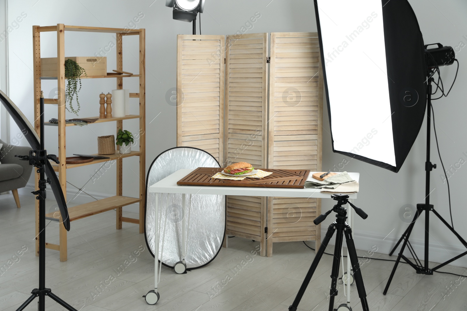 Photo of Tasty sandwich on table in photo studio. Food photography