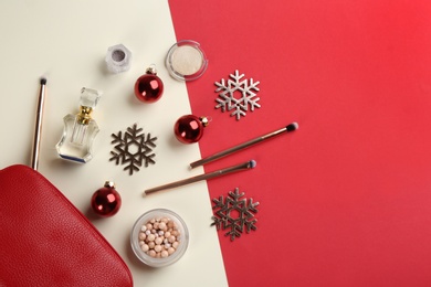 Photo of Flat lay composition with decorative cosmetic products on color background. Winter care