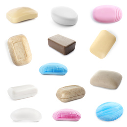 Set of different soap bars on white background