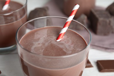 Delicious chocolate milk in glass, closeup view