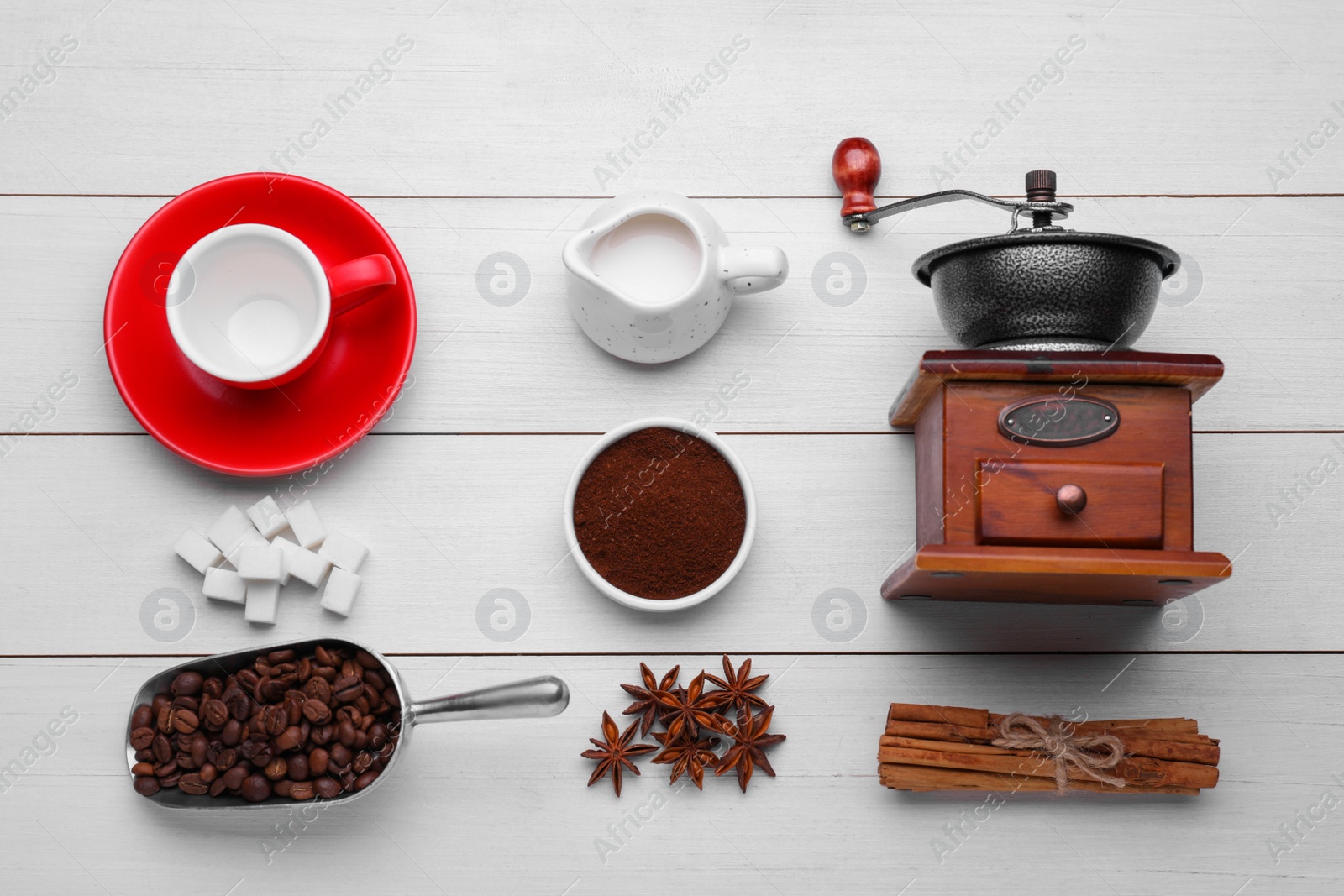 Photo of Flat lay composition with vintage manual coffee grinder and spices on white wooden background