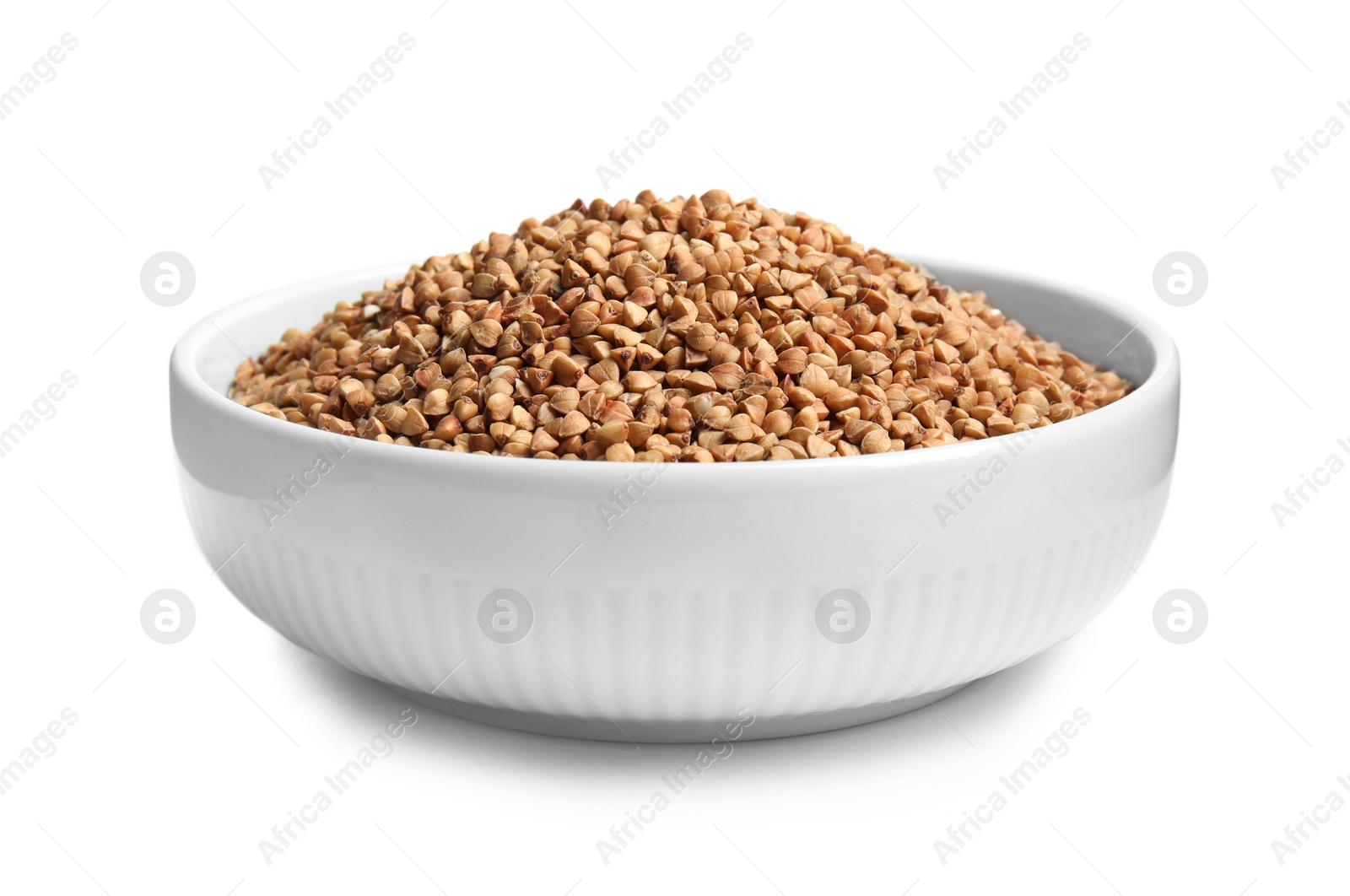 Photo of Bowl with uncooked buckwheat on white background