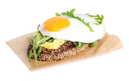 Photo of Delicious sandwich with arugula and fried egg isolated on white