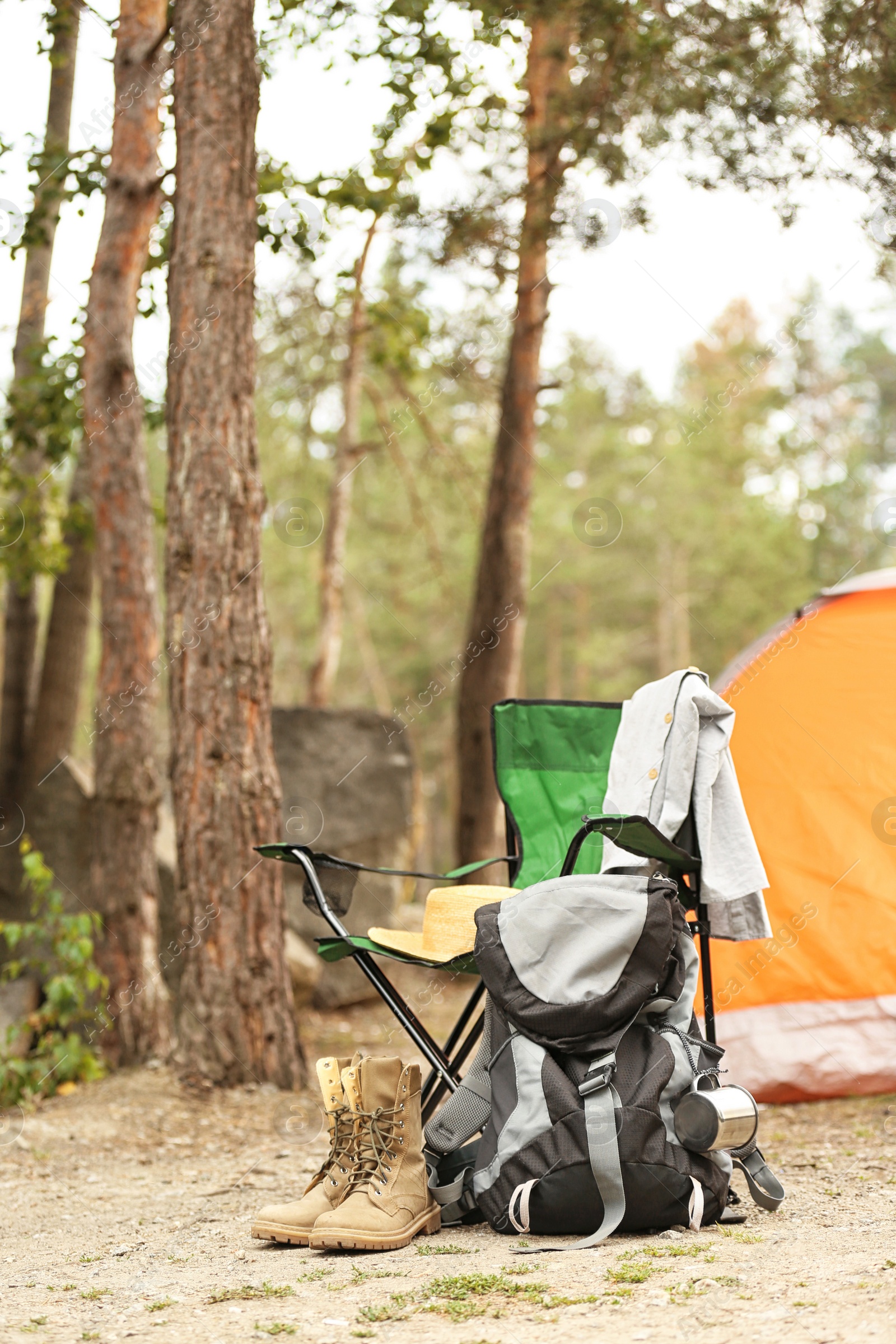 Photo of Set of camping equipment outdoors on summer day