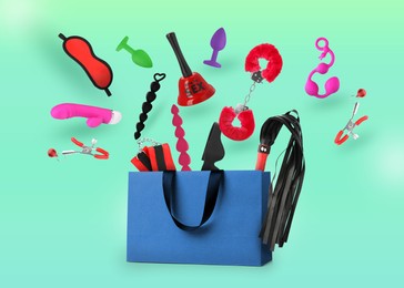 Image of DIfferent sex toys and accessories falling into paper shopping bag on cyan background