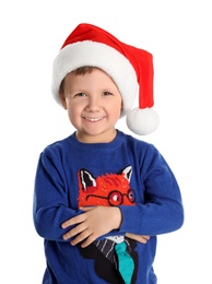 Photo of Cute little boy wearing Santa Claus hat on white background