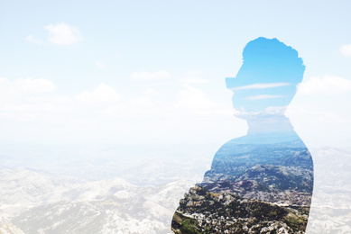 Image of Double exposure of businessman and mountain landscape, space for text