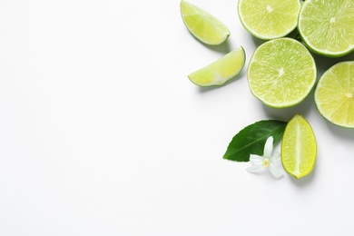 Photo of Fresh limes on white background, top view. Citrus fruits