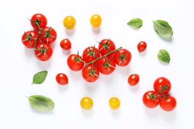 Photo of Composition with ripe cherry tomatoes and basil leaves on white background, top view