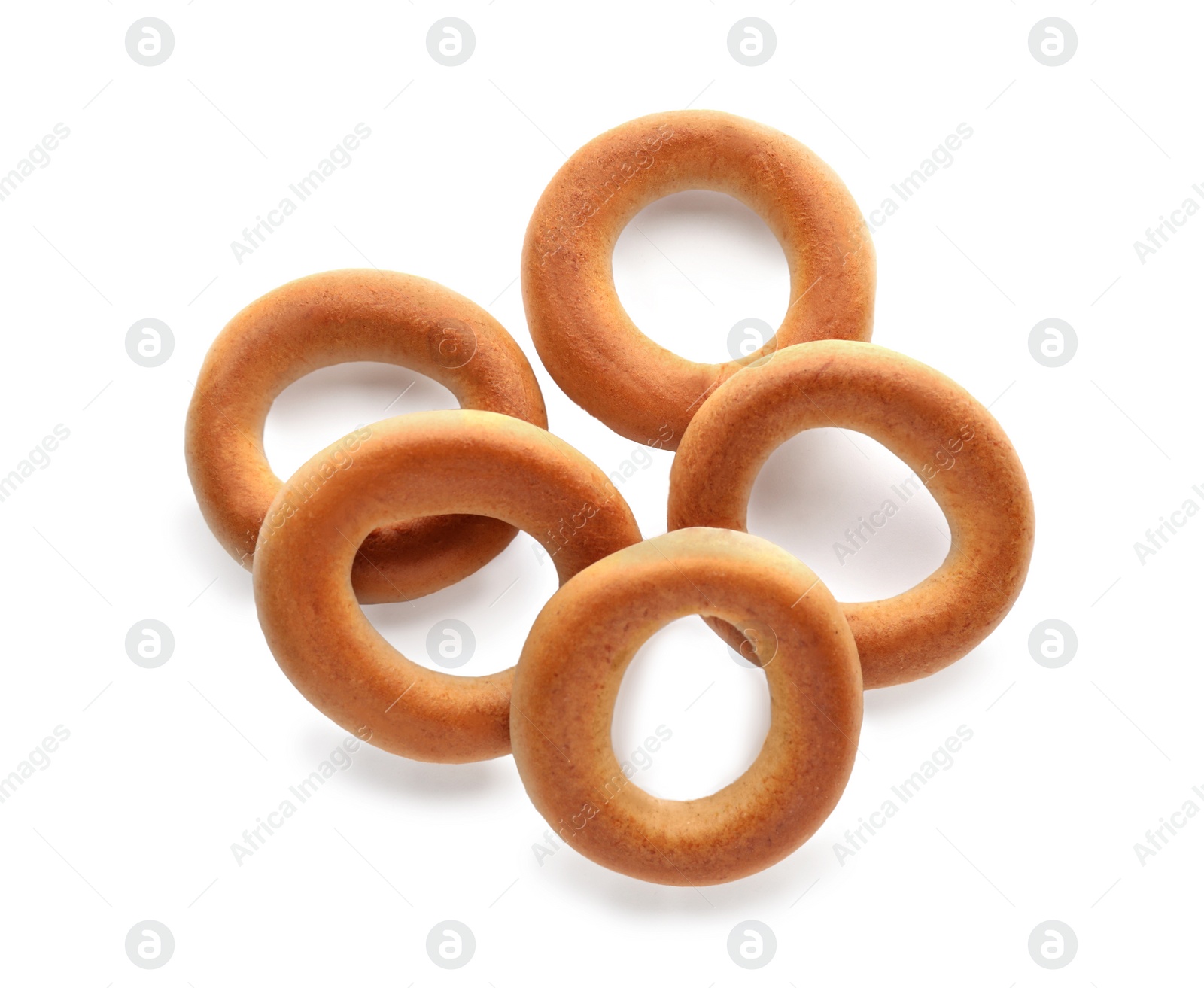 Photo of Tasty dry bagels (sushki) isolated on white, top view